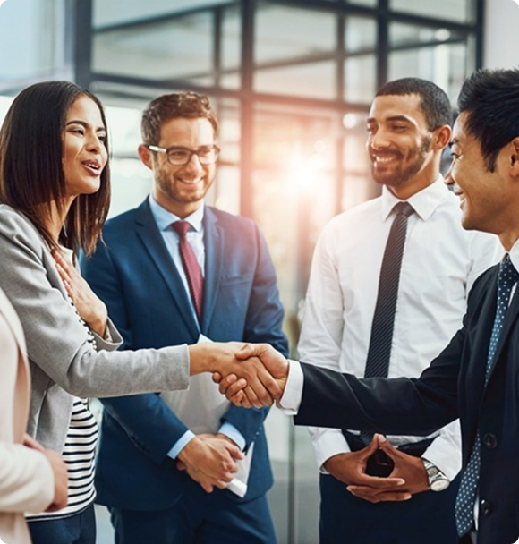Business team shaking hands and finalizing strategic partnership in modern office